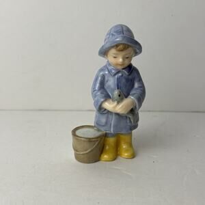 Royal Copenhagen figurine titled "Peter Fisherman's Boy" model #010